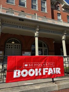 Scholastic Book Fair Banner hanging outside of school building