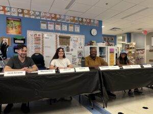 Q and A with adults at a table