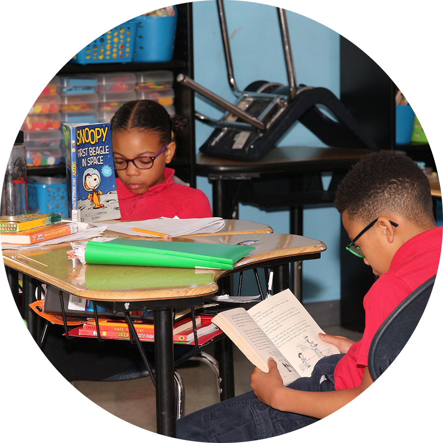 Students reading books at their desks